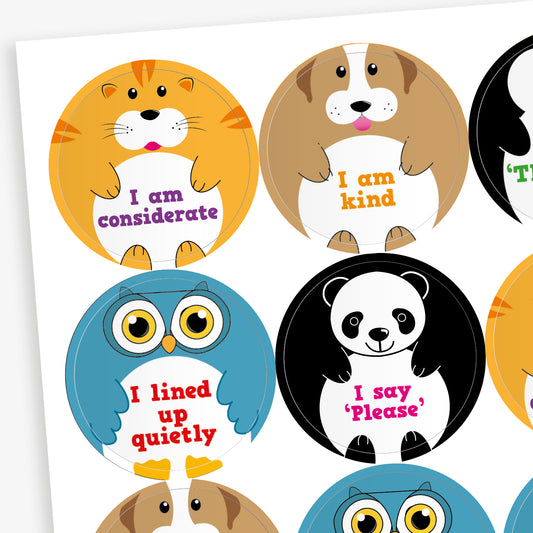 Sheet of round animal-themed stickers, each with a positive message. Designs include a cat saying 'I am considerate', a dog with 'I am kind', an owl stating 'I lined up quietly', and a panda with 'I say please'. Each cartoon animal holds a white circle displaying the message in colourful text.