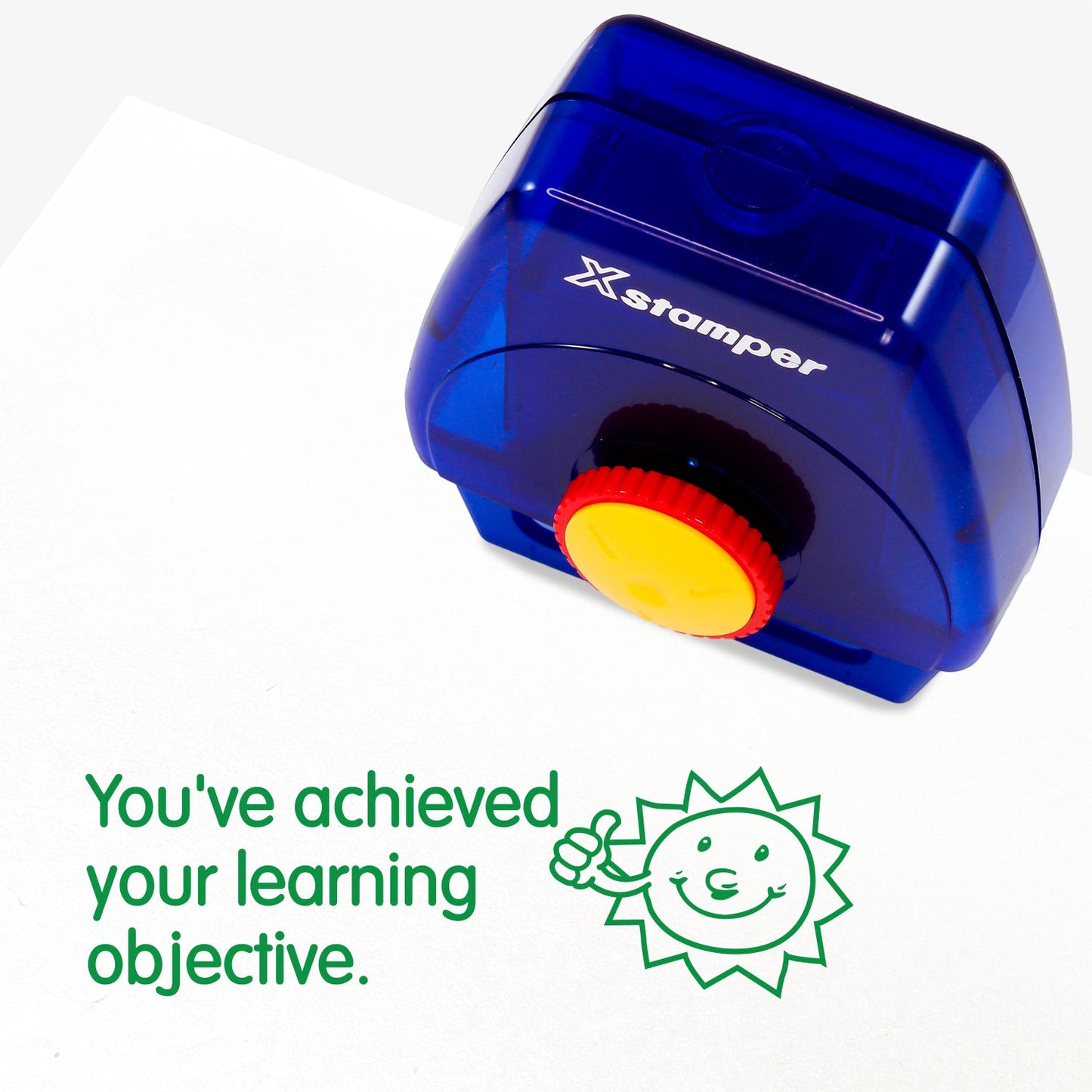 One Twist N Stamp brick in green ink. An smiling sun with a thumbs up, alongside the phrase 'You've achieved your learning objective'