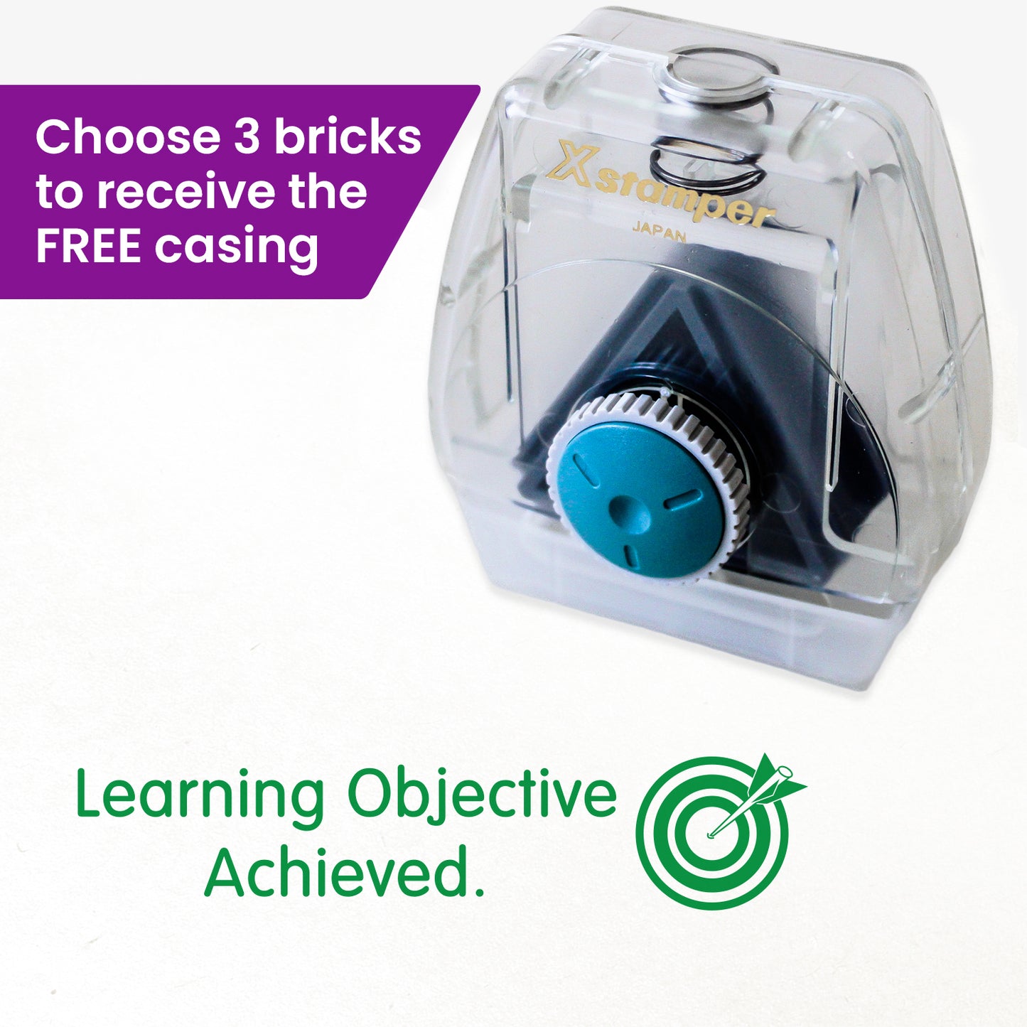 One Twist N Stamp brick in green ink.  An arrow hitting a bullseye, alongside the phrase 'Learning Objective Achieved'