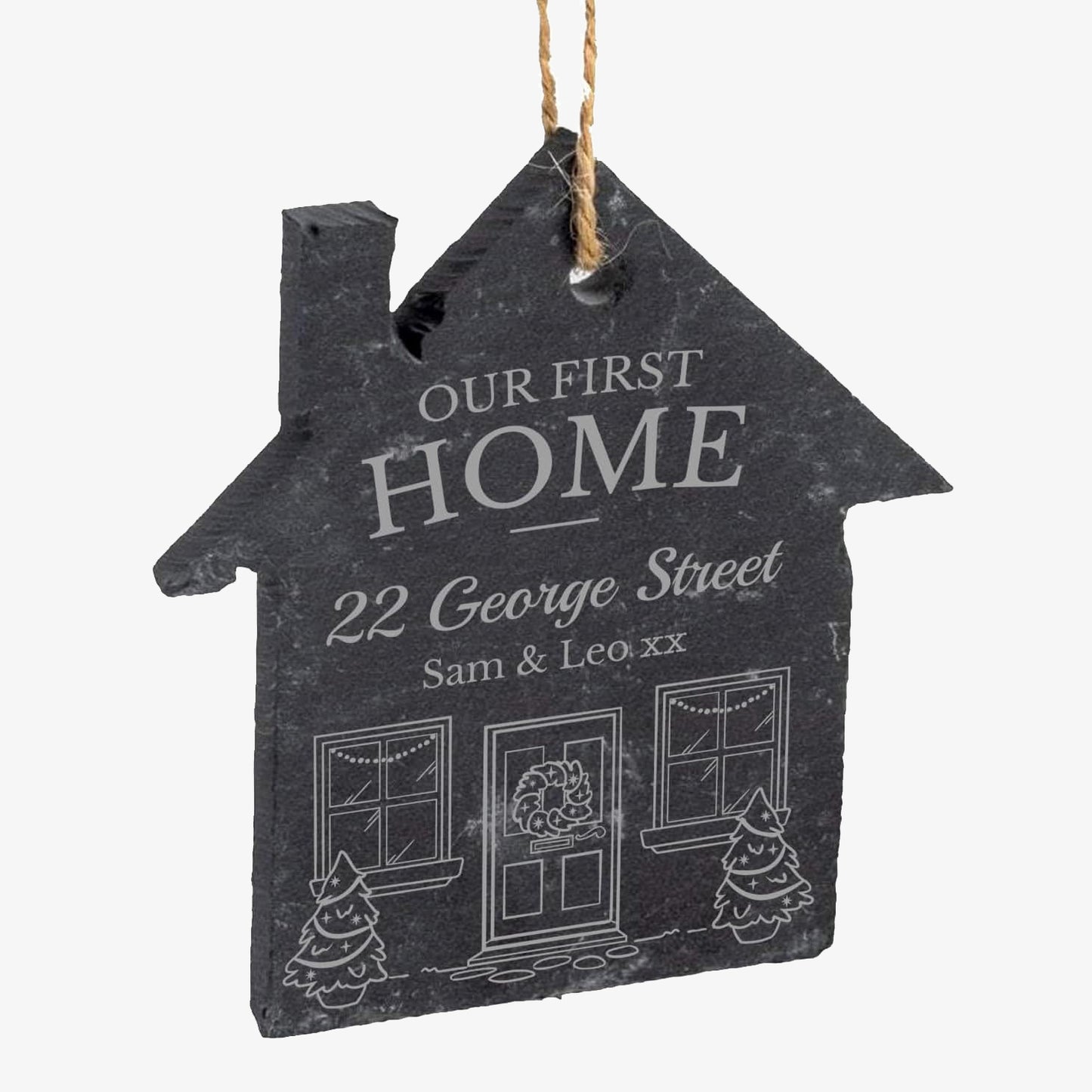 House-shaped slate plaque with 'Our First Home' text and personalisation on a white background