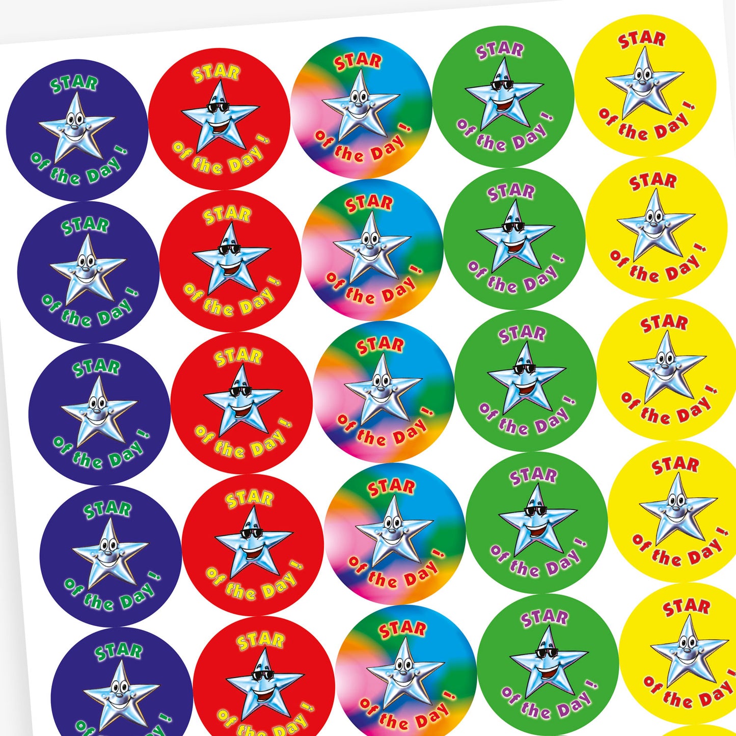 Sheet of round 'Star of the Day' reward stickers featuring smiling cartoon stars with expressive faces. Each sticker has the same message but comes in a variety of vibrant background colours, including green, blue, red, and yellow.