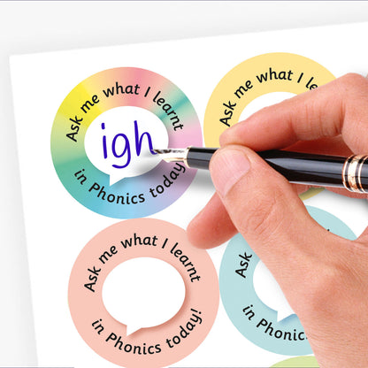 Four colorful circular stickers with text 'Ask me what I learnt in Phonics today!' and a hand writing in the phonics snippet.