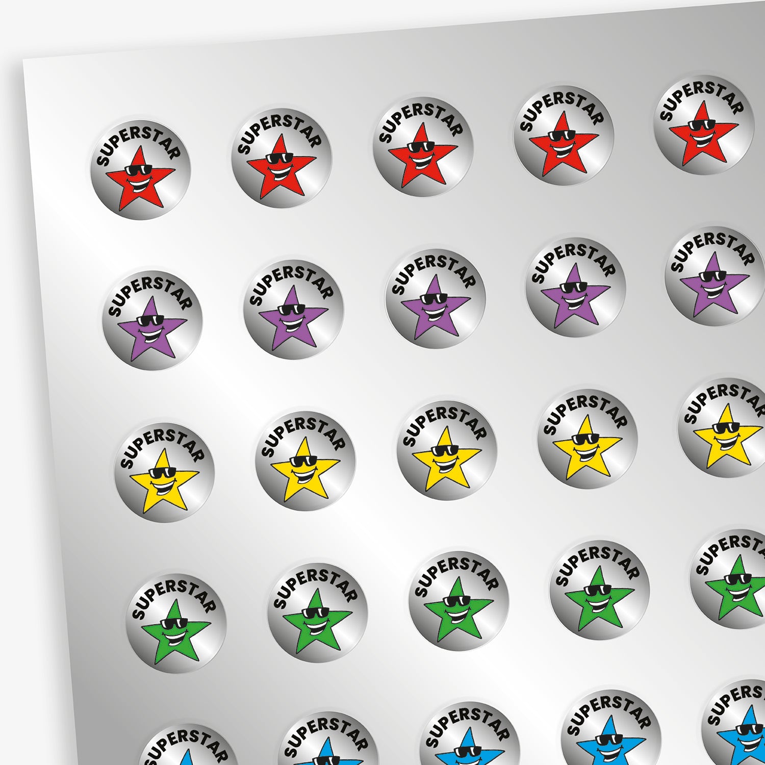 Sheet of 196 metallic 10mm circular silver reward stickers, each with either a red, blue, pink, green, yellow or purple star wearing sunglasses beneath the word 'Superstar' in bold black lettering. The stickers have a shiny, reflective finish and are designed to motivate and reward pupils' achievements.