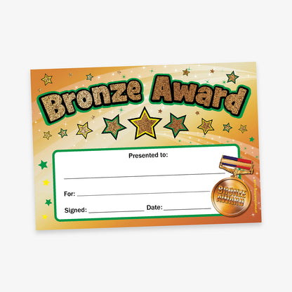 Pack of 100 A5-sized holographic Bronze Award certificate featuring a shimmering bronze background adorned with gold and green stars, bold 'Bronze Award' title at the top, and designated spaces for 'Presented to', 'For', 'Signed', and 'Date'; printed on high-quality 350gsm card, ideal for recognising pupil achievements.