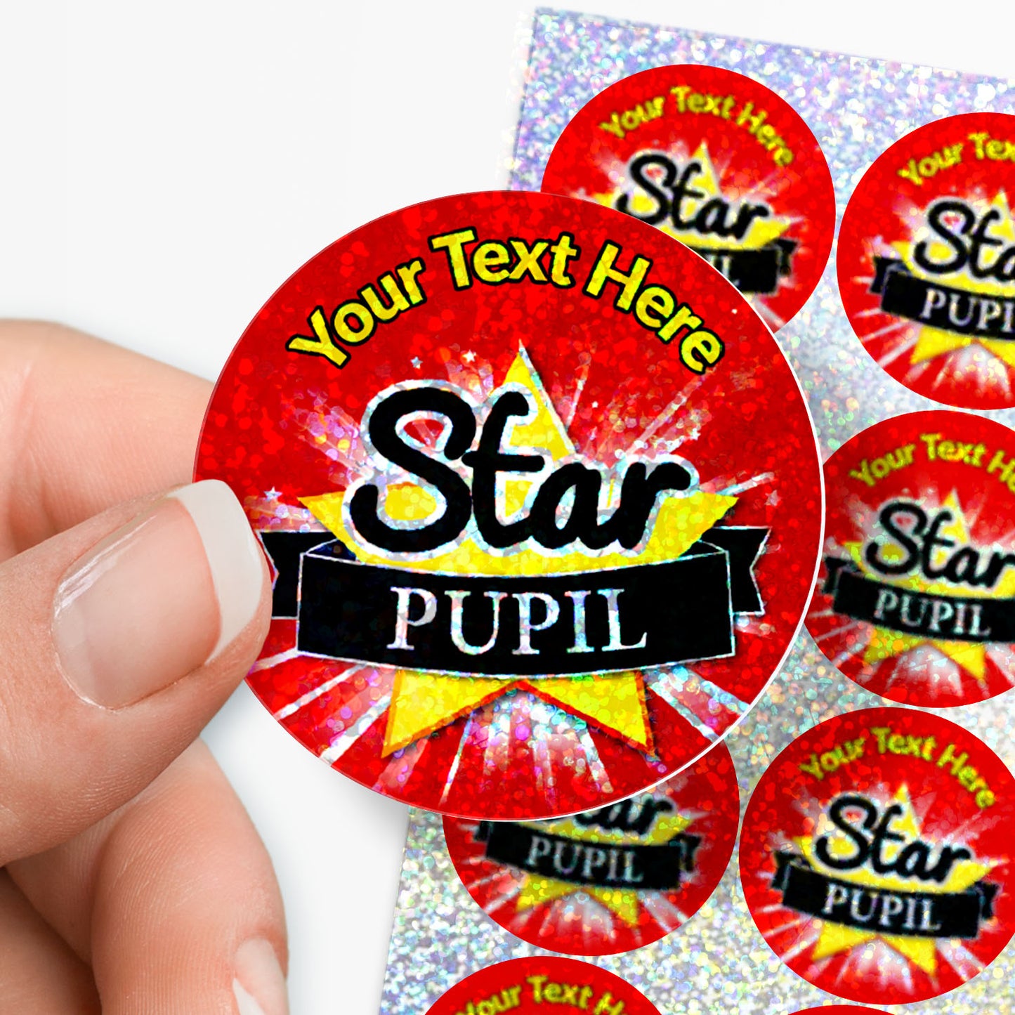Red 'Star Pupil' stickers with customizable text held by a hand.