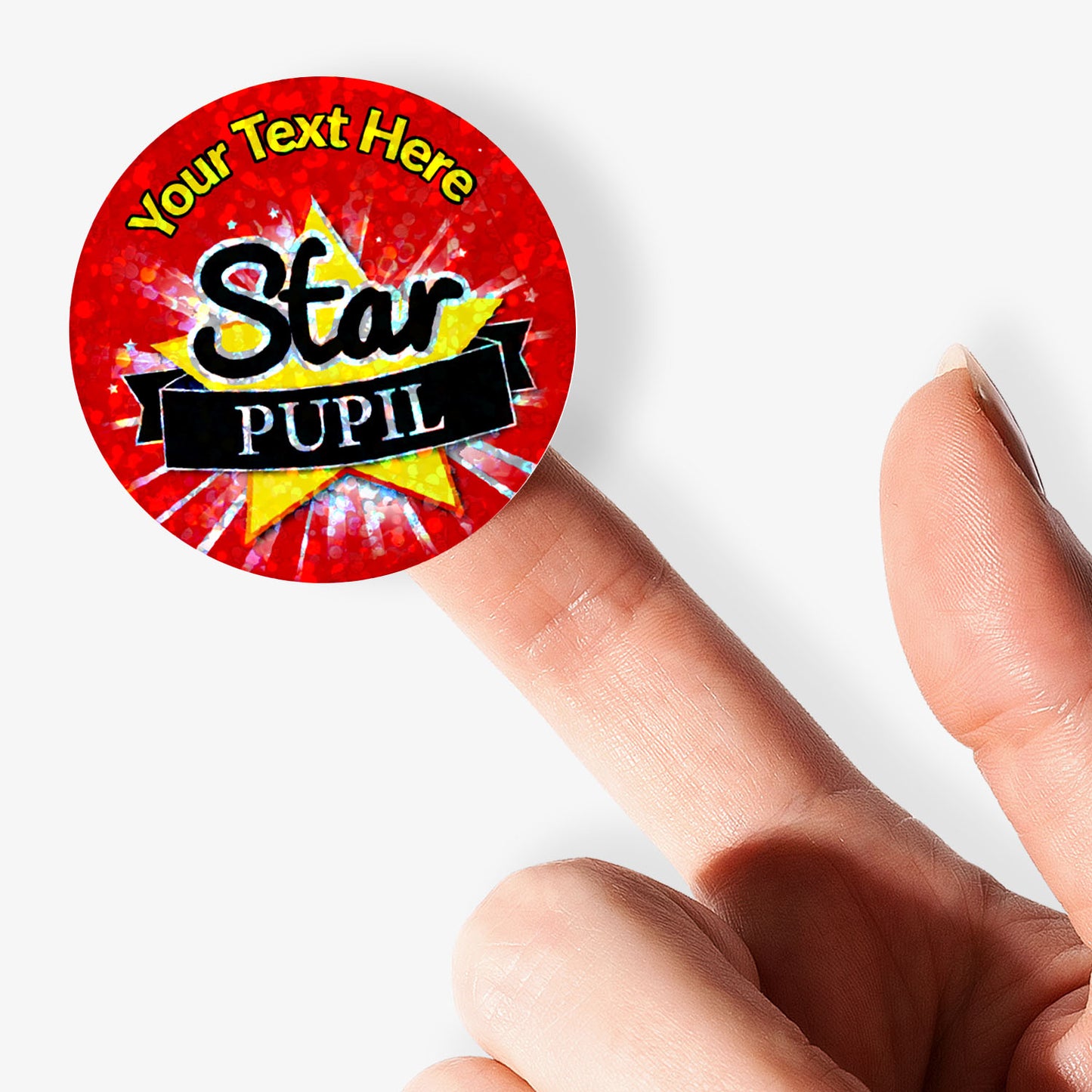 Red 'Star Pupil' sticker with customizable text held by a finger on a white background