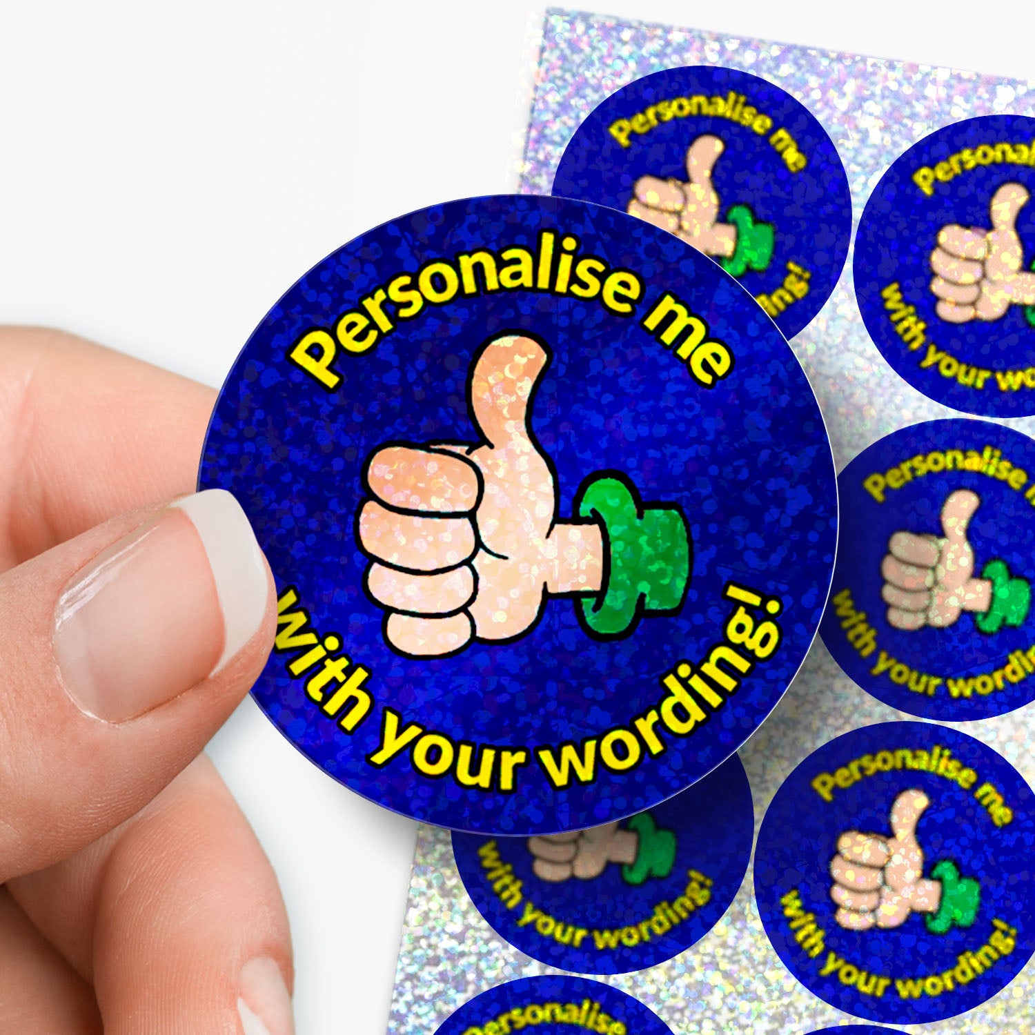 Stickers with thumbs up icons and text on a blue background held in between fingers