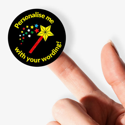 Round sticker with text 'Personalise me with your wording!' held between fingers on a white background