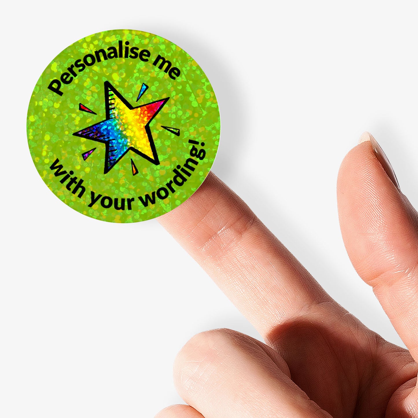 Round green sticker with colorful star and text 'Personalise me with your wording!' held by a hand.