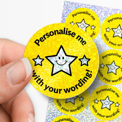 Personalised holographic yellow stickers with star design and text 'Personalise me with your wording!' held by a hand.