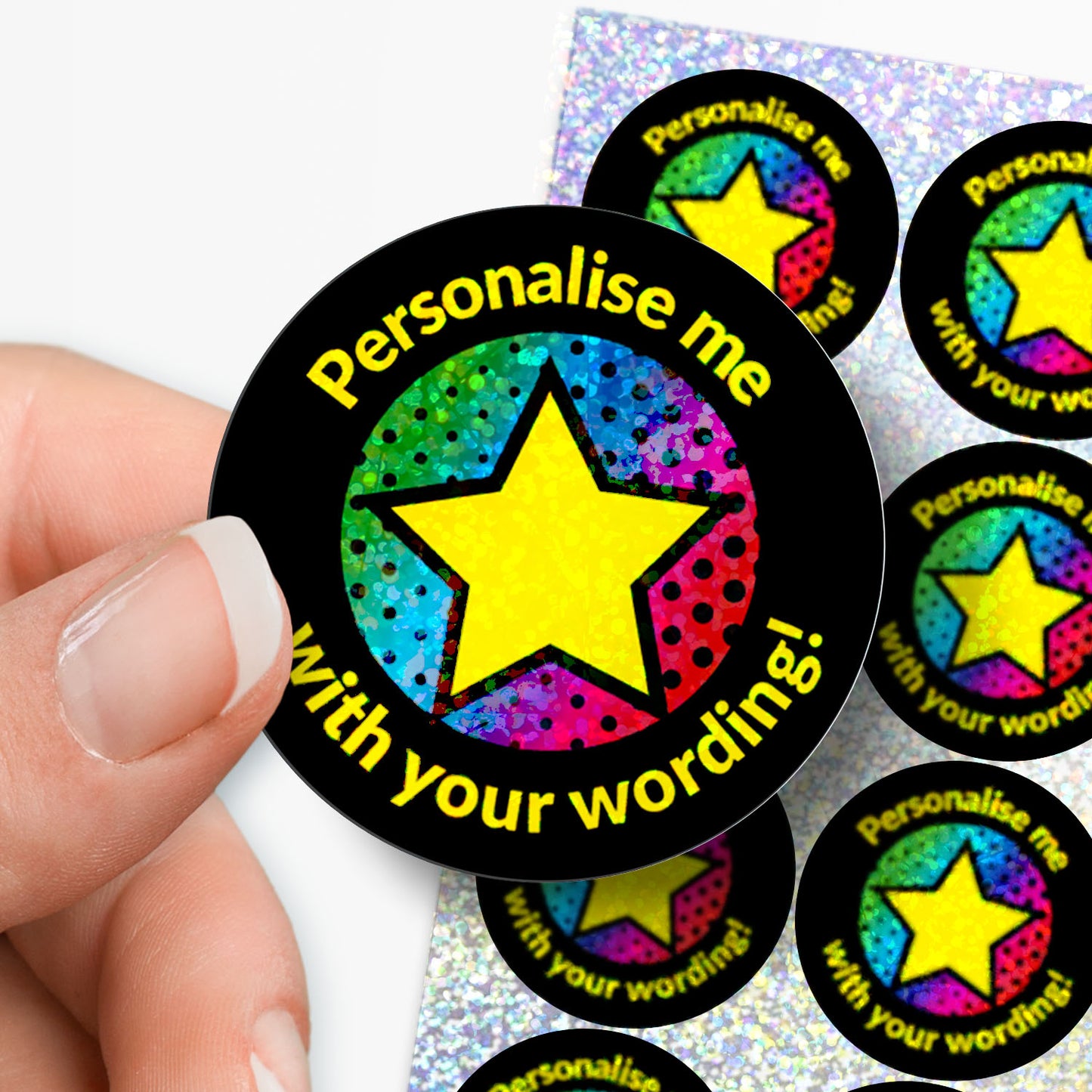Colorful star-shaped stickers with text 'Personalise me with your wording!' held by a hand.