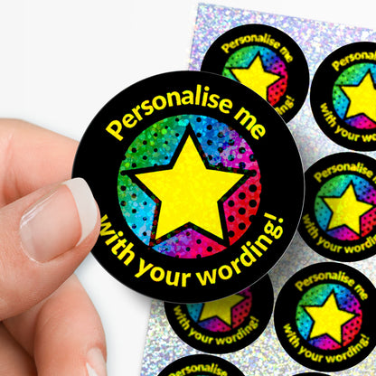 Colorful star-shaped stickers with text 'Personalise me with your wording!' held by a hand.