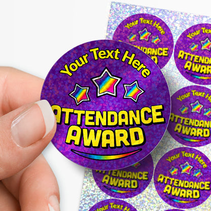 Purple personalised holographic 'Attendance Award' stickers with customizable text held by a hand.