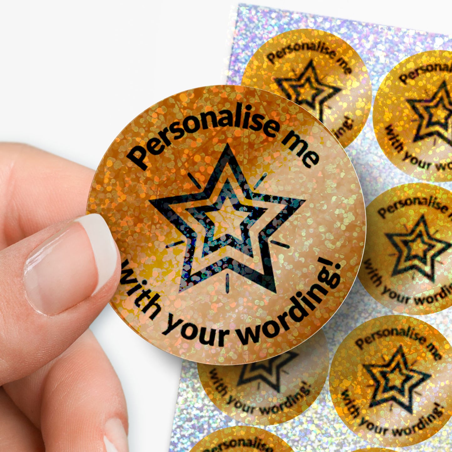 Personalised Bronze star sticker with 'Personalise me with your wording!' text, held by a hand.
