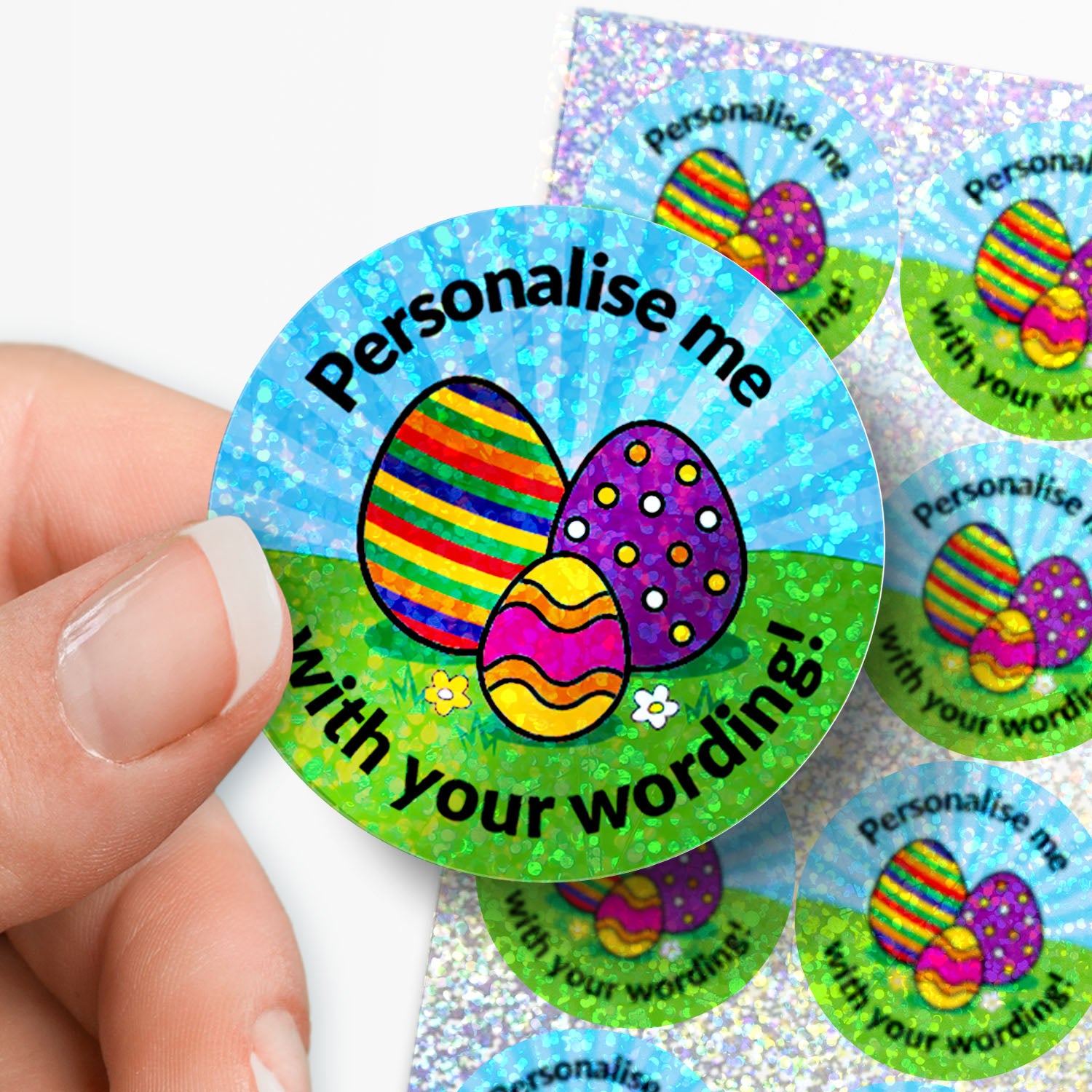 Colorful Easter egg stickers with text 'Personalise me with your wording!' held by a hand.