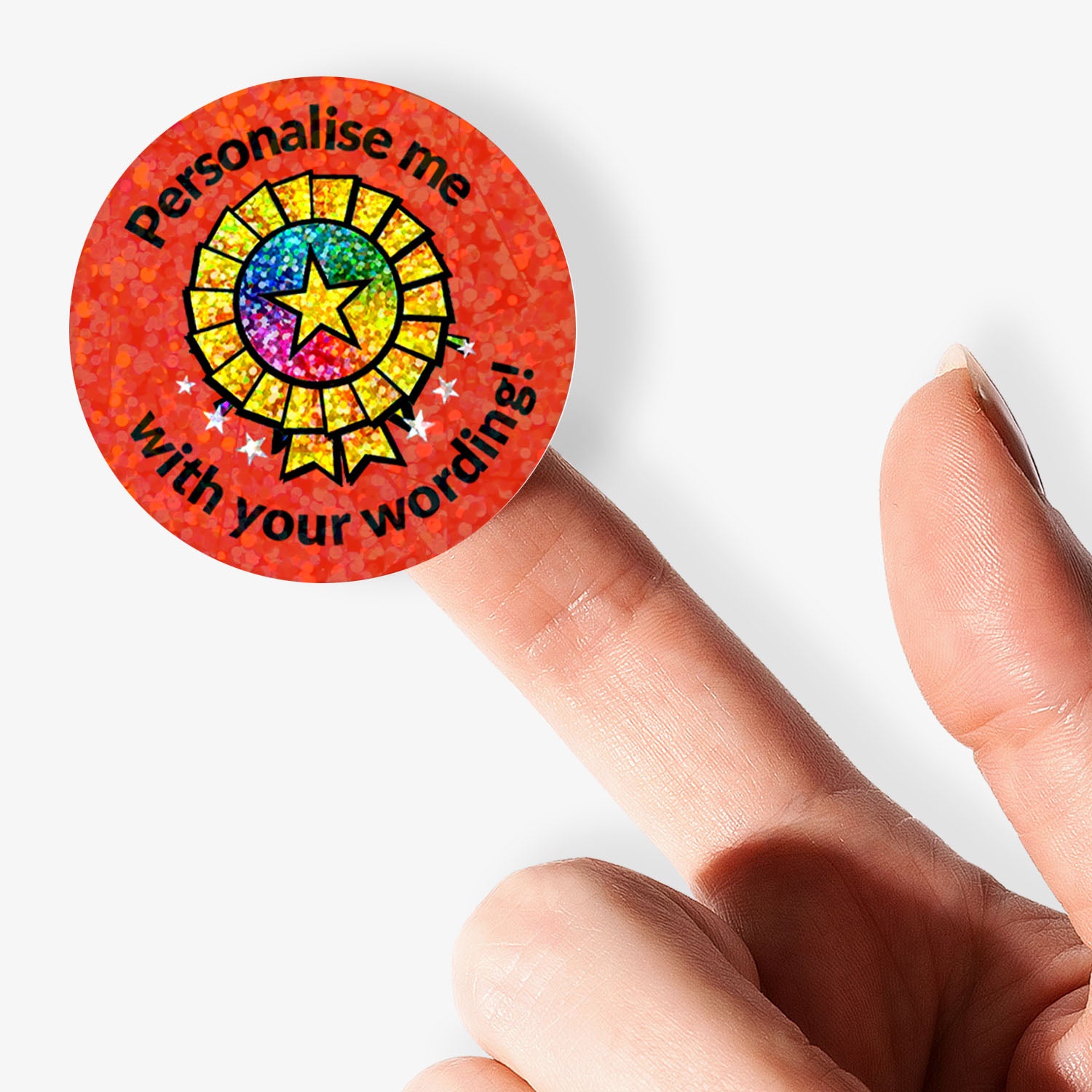 Round customizable sticker with colorful design and text held by a finger on a white background