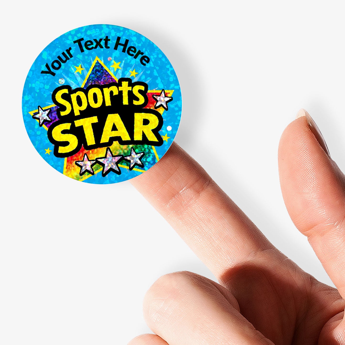 Colorful 'Sports Star' badge held by a hand on a white background