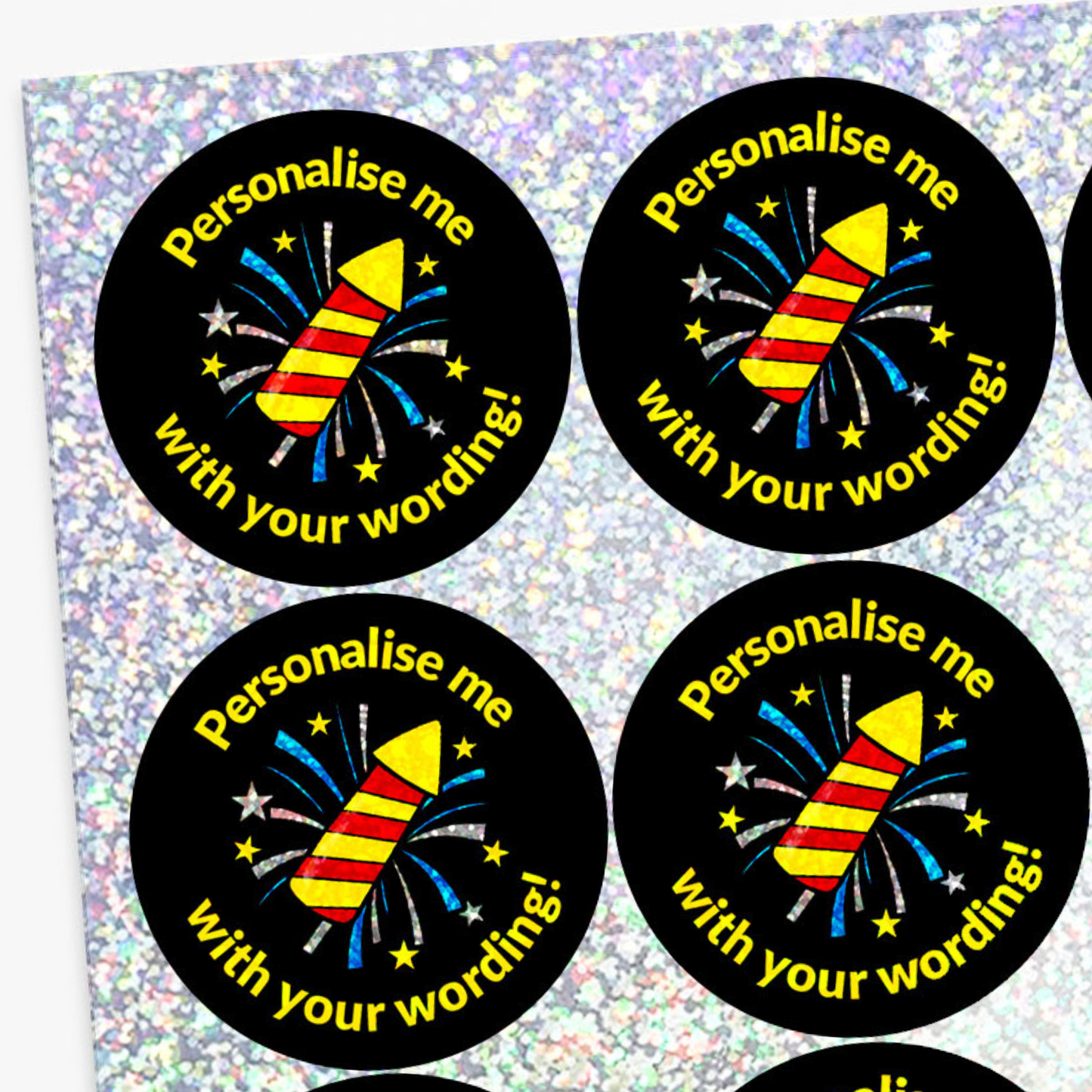 Four round stickers with fireworks design and text on a glittery background