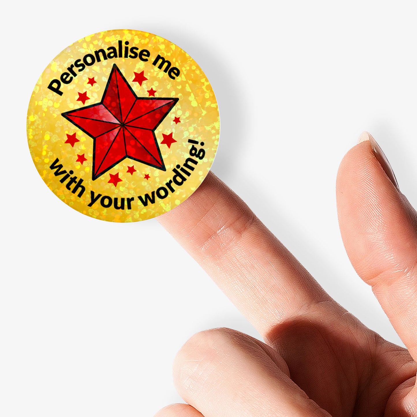 Circular sticker with Red Star and personalised text held by hand.
