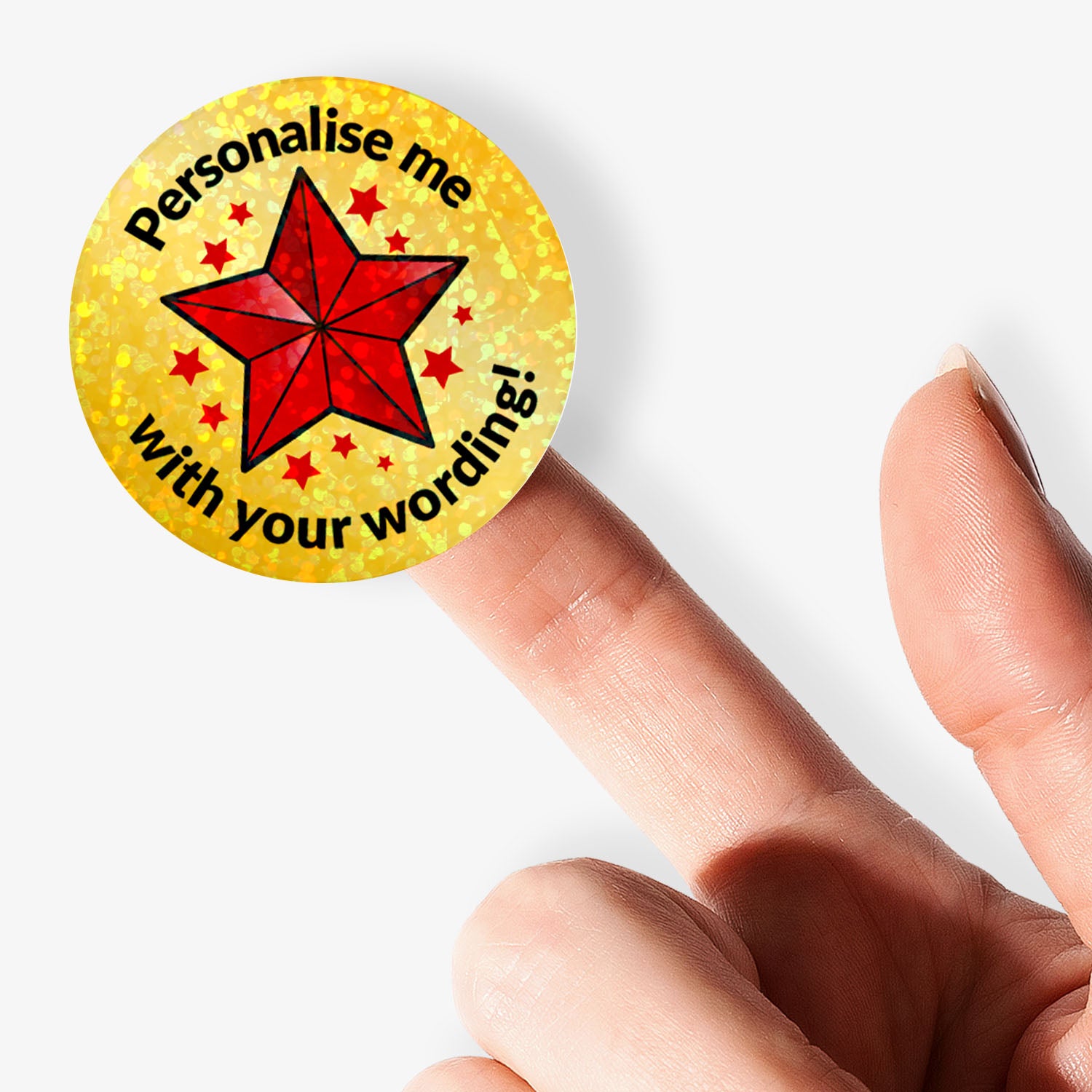 Circular sticker with Red Star and personalised text held by hand.