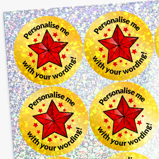 Four yellow stickers with red stars and text on a glittery background