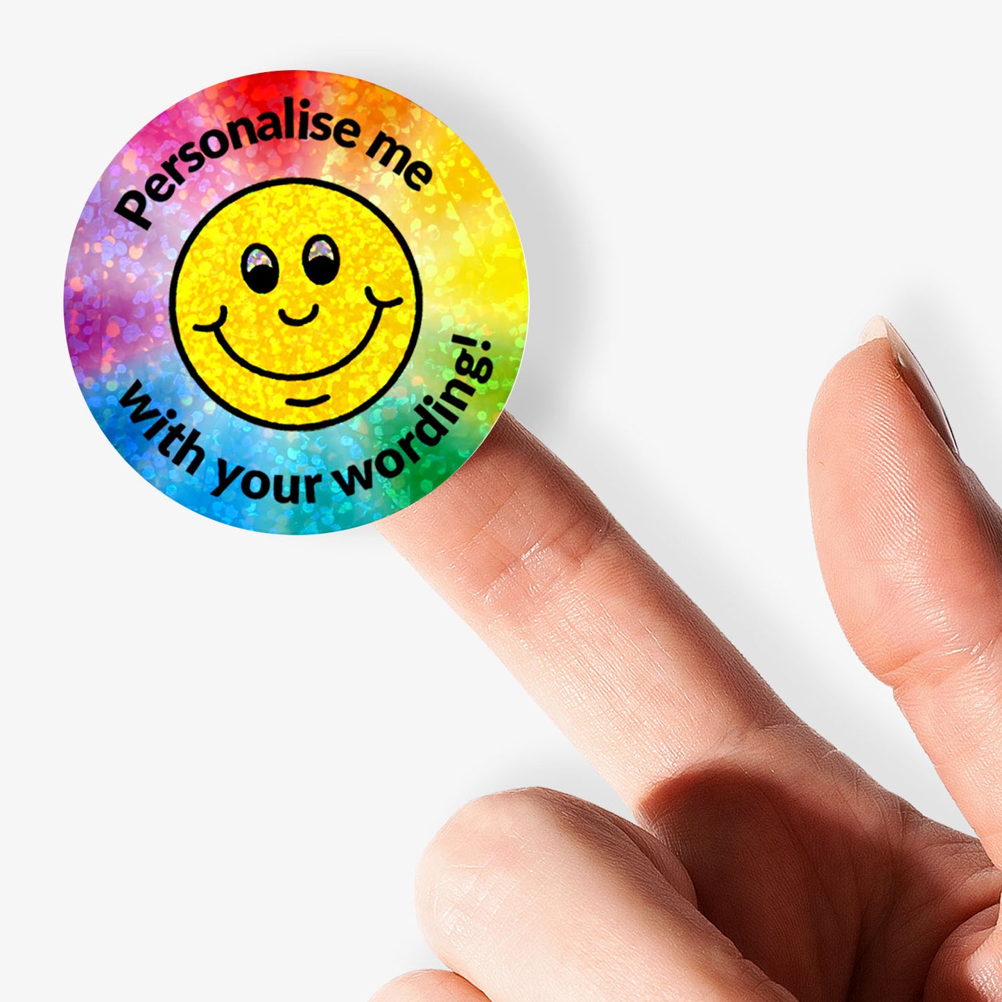 Sparkly Smiley face sticker with 'Personalise me with your wording!' text held by a hand.