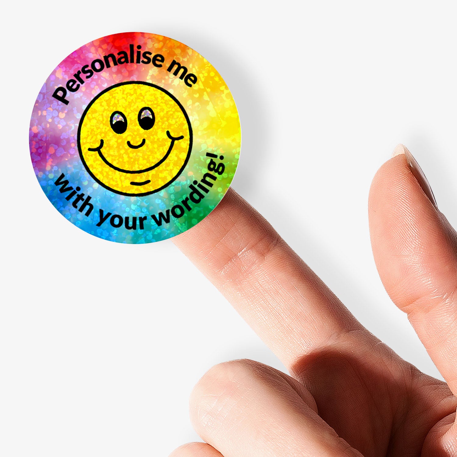 Sparkly Smiley face sticker with 'Personalise me with your wording!' text held by a hand.