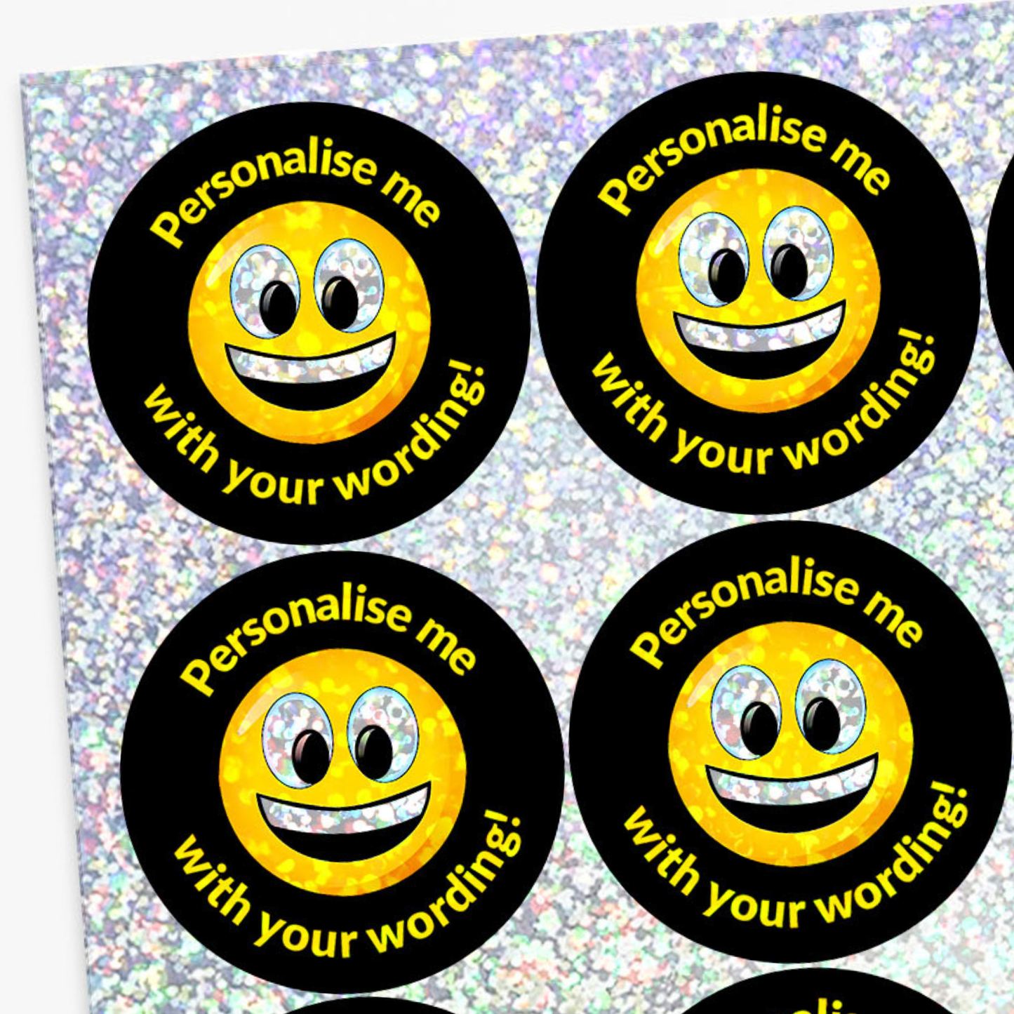 Four round stickers with smiley faces and text on a glittery background