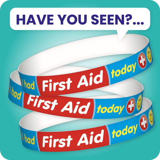 Have you seen?... A set of ten blue wristbands featuring the phrase 'I had First Aid today' in bold white and yellow text, accompanied by a red cross symbol; designed to inform staff and parents that a pupil has received first aid during school hours