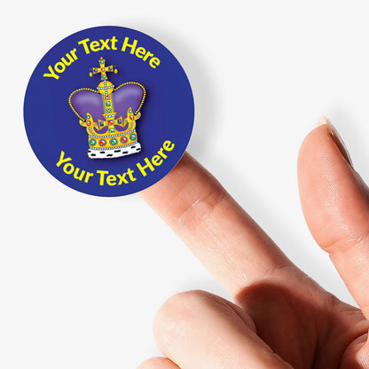Personalizable sticker with a crown design held between fingers on a white background