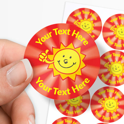 Red stickers with yellow sun design and 'Your Text Here' text held by a hand.