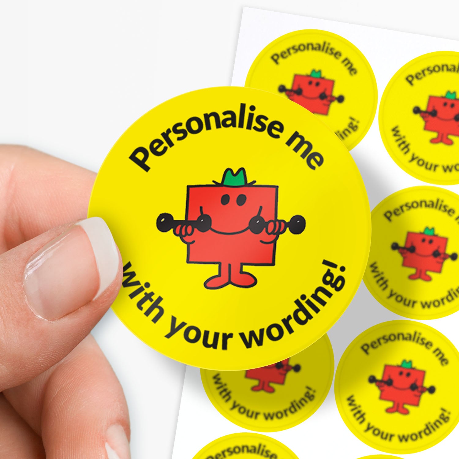 Yellow stickers with a red Mr Strong character and text 'Personalise me with your wording!' held by a hand.