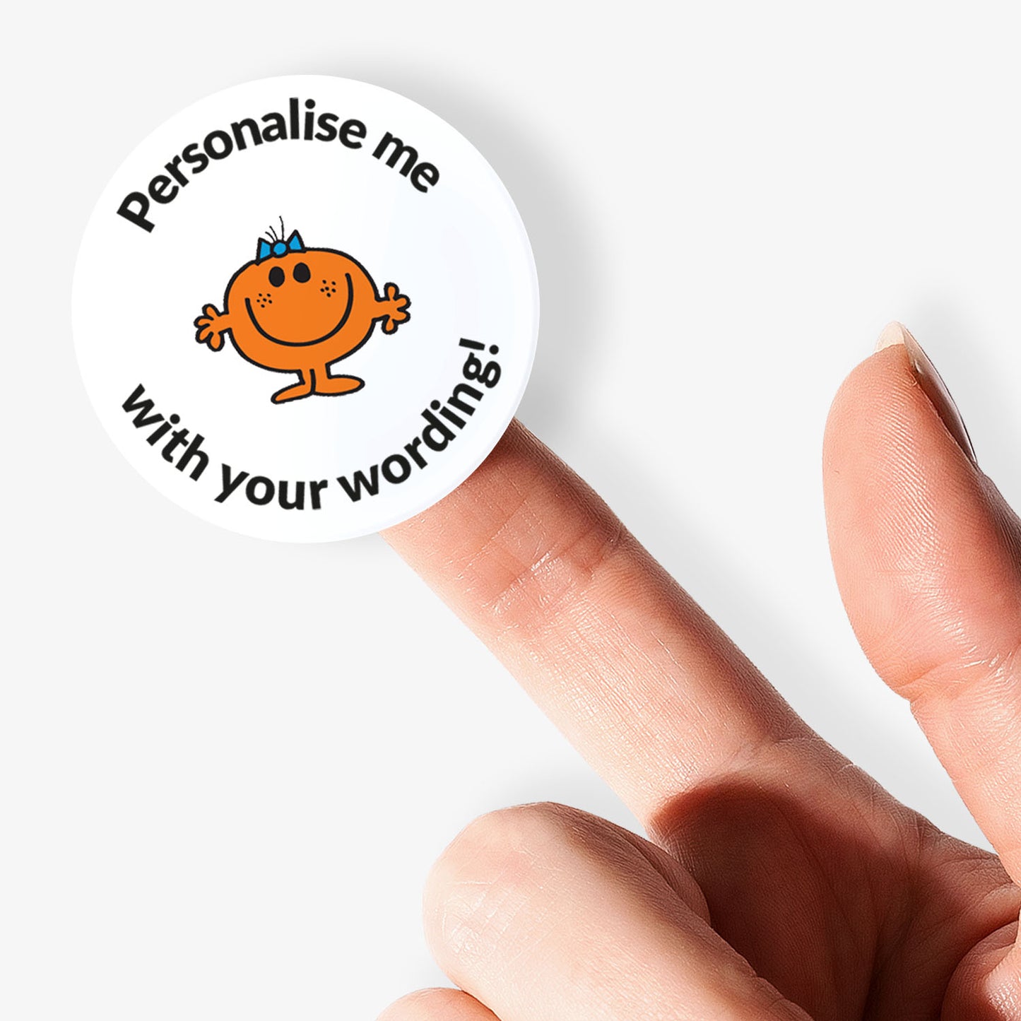 Circular sticker with Mr. Men character and text 'Personalise me with your wording!' held by a finger.