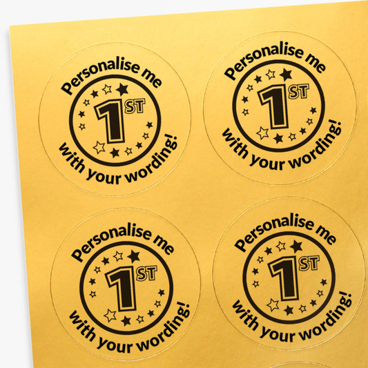 Four round stickers with 'Personalise me 1st' text on a gold background