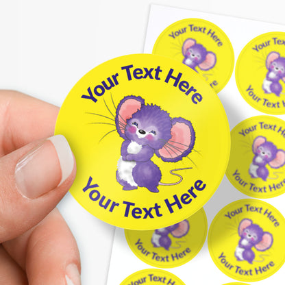 Personalizable yellow stickers with a purple mouse design and text area, held by a hand.