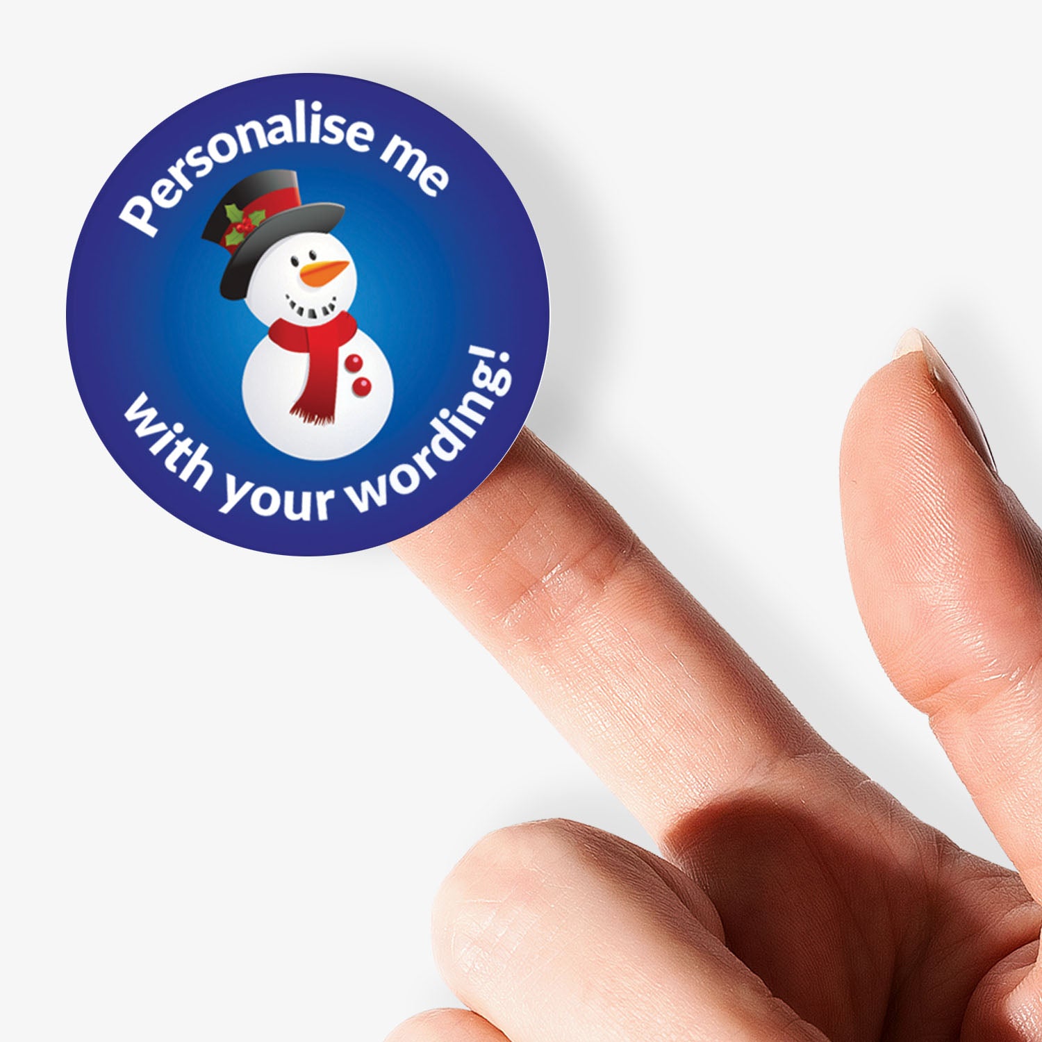 Round sticker with snowman design and text 'Personalise me with your wording!' held by a finger.