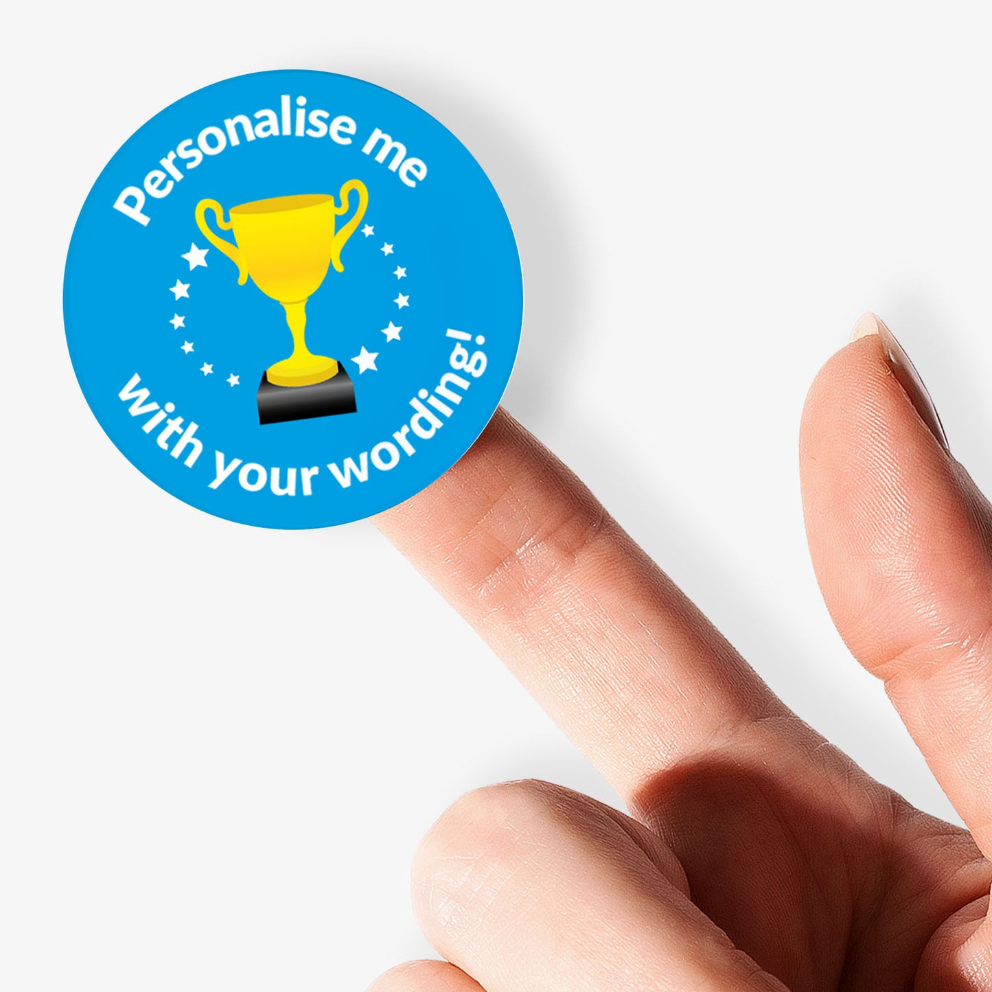 Sticker with a trophy graphic and text 'Personalise me with your wording!' held between fingers.
