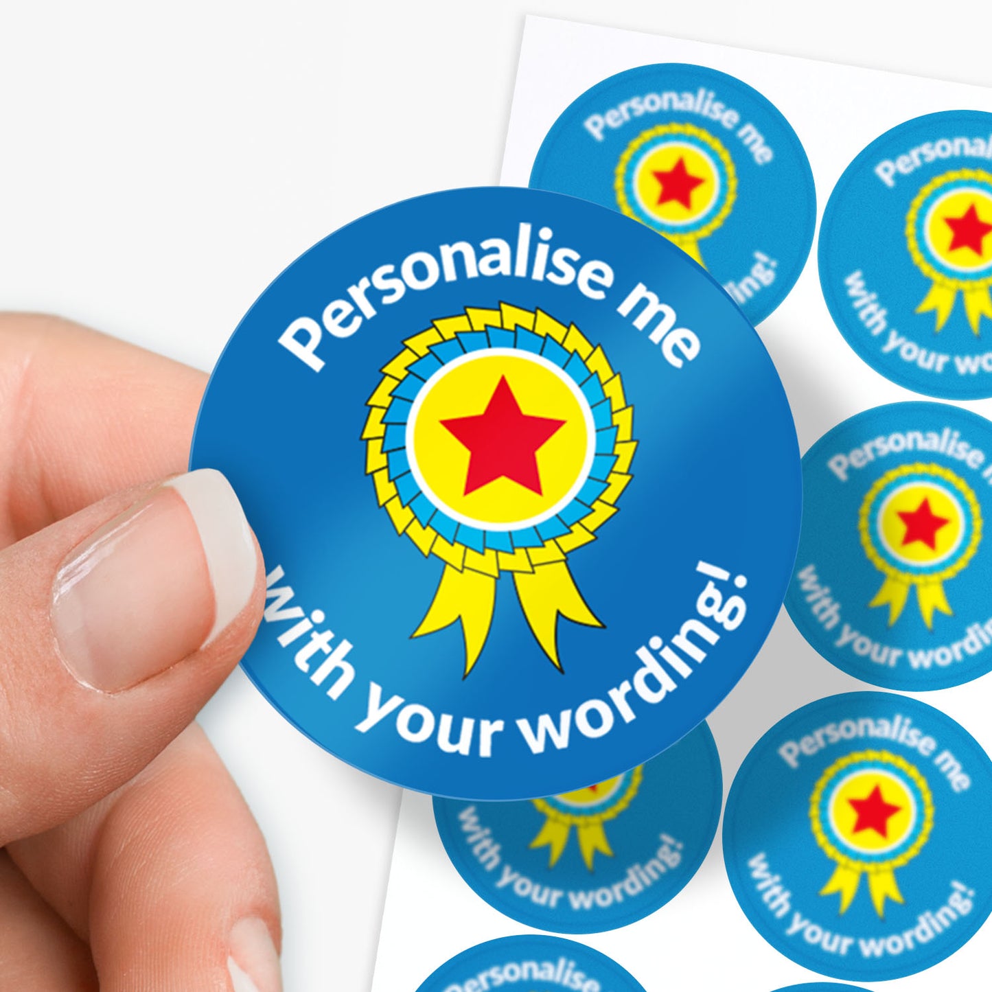 Circular blue sticker with a yellow star and text 'Personalise me with your wording!' held by a hand.
