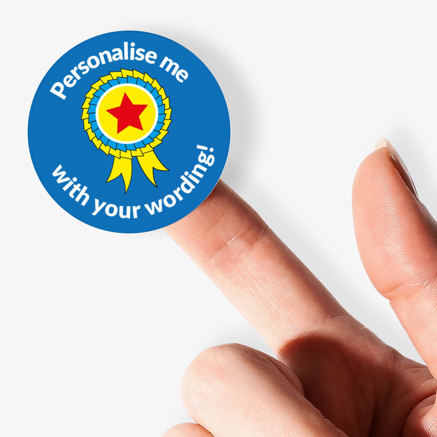 Round sticker with a star design and text 'Personalise me with your wording!' held between fingers.