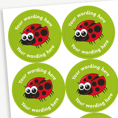 A sheet of green stickers featuring a central image of a cartoon ladybird.  Placeholder text 'Your wording here' is above and below the image.