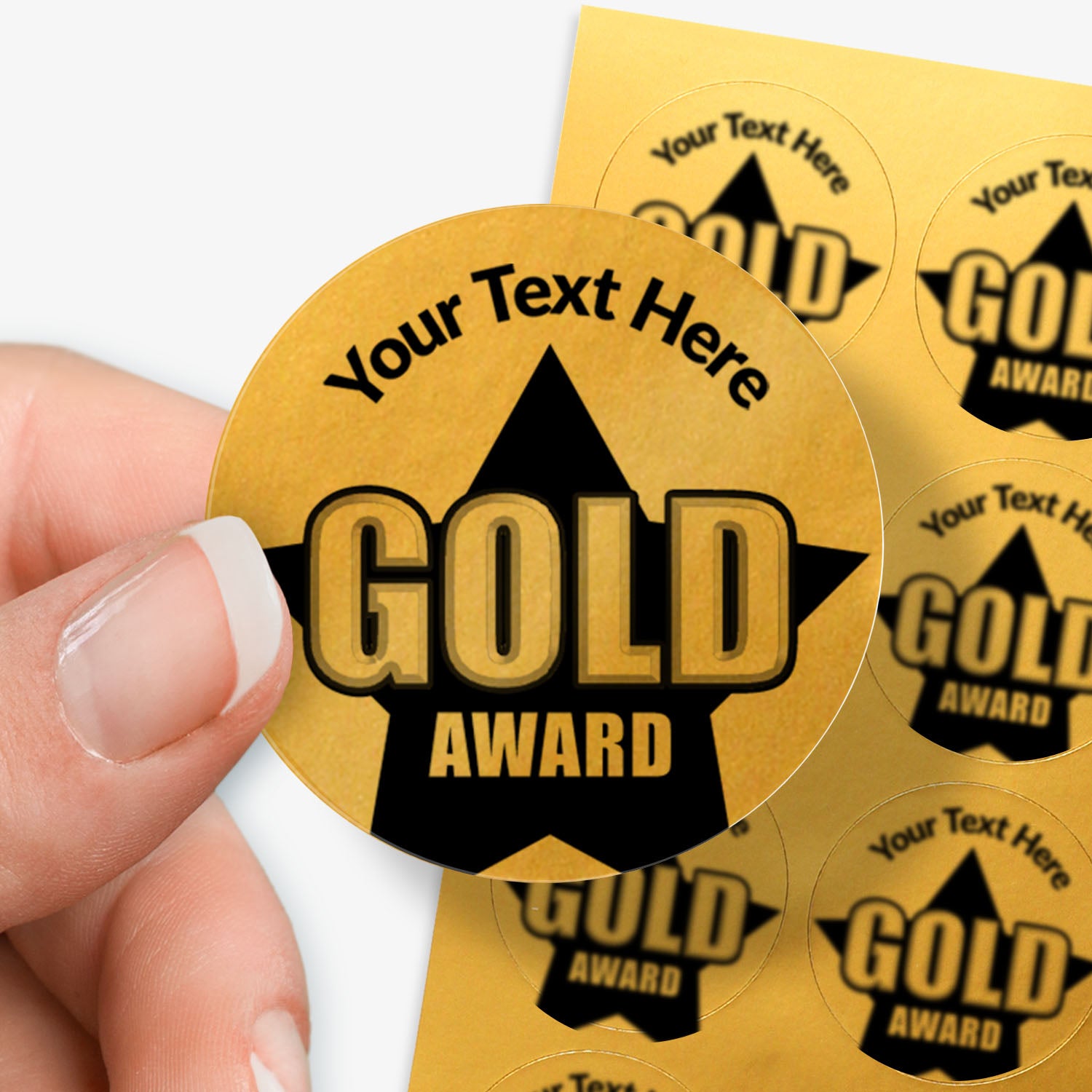 Gold award stickers with customizable text held by a hand.