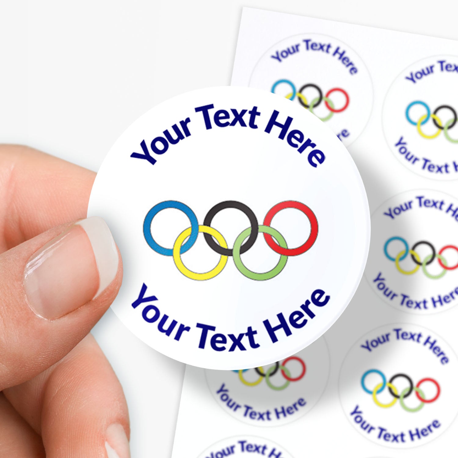 White stickers with Olympic rings as a central image.  Space for personalisation above and below the image.