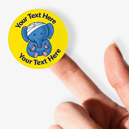 Yellow sticker on a finger with an elephant with a bandage on it's head as a central image.  Space for personalisation above and below the image.