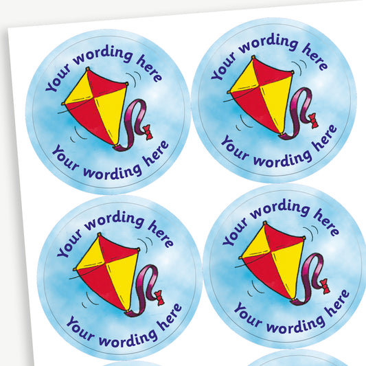 A sheet of blue sky stickers featuring a central image of a red and yellow kite.  Placeholder text 'Your wording here' is above and below the image.