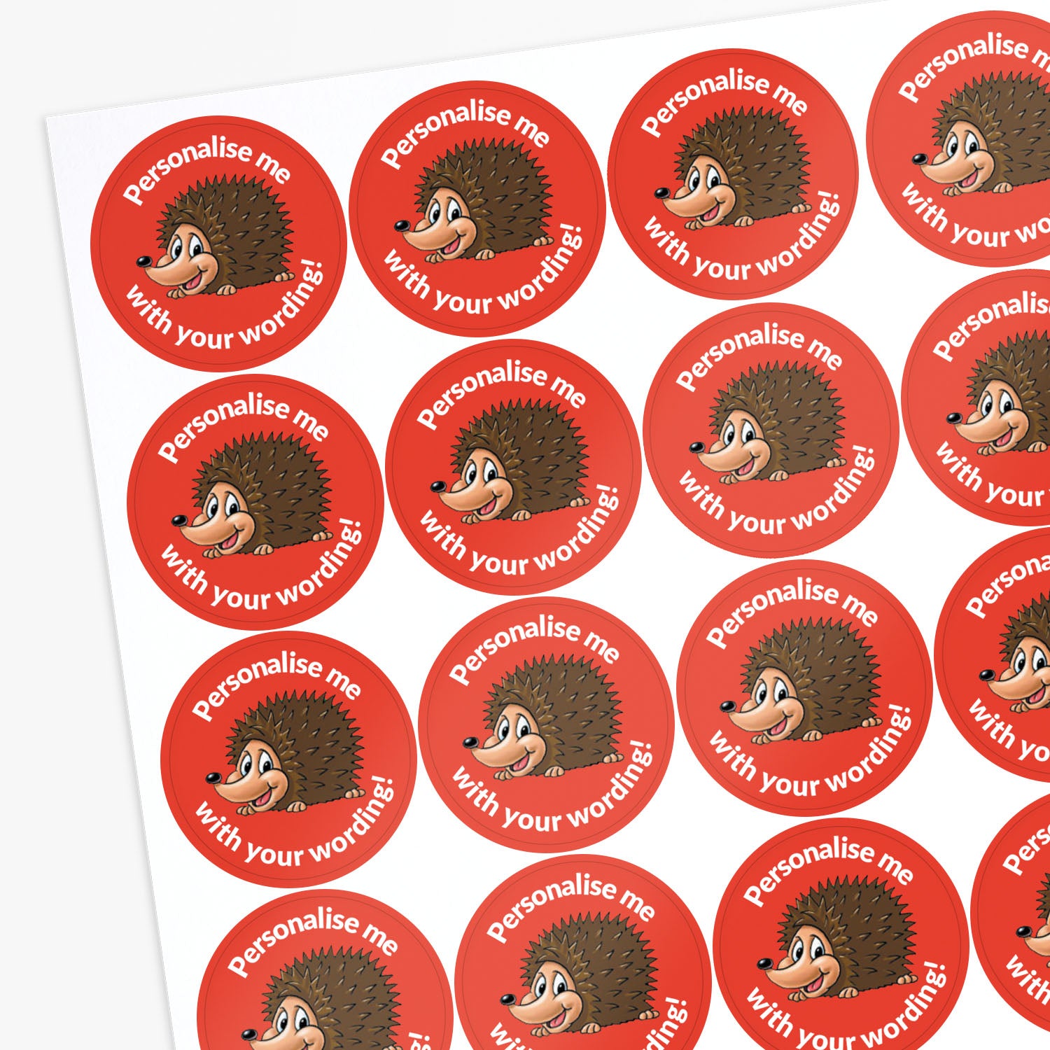 Red stickers with a smiling hedgehog as a central image.  Space for personalisation above and below the image.