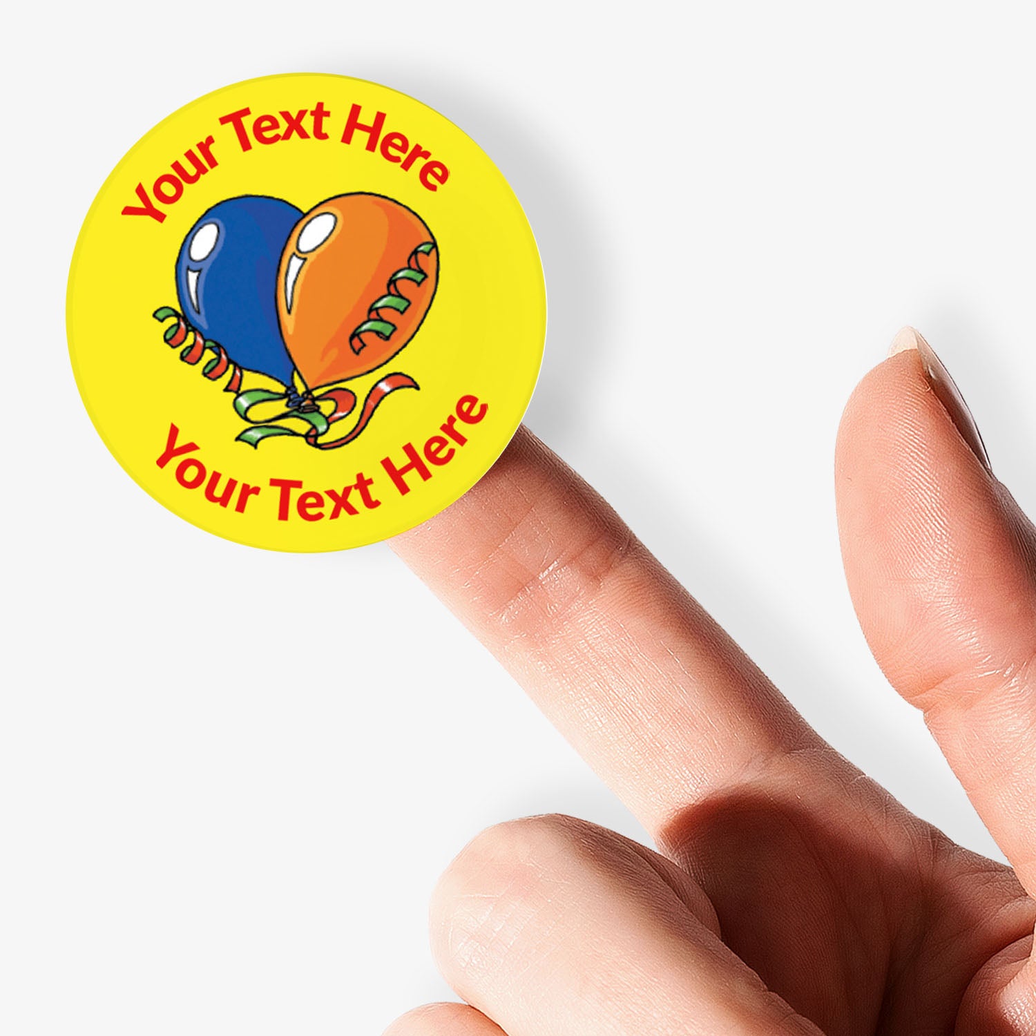 Personalizable sticker with colorful balloons held by a finger on a white background