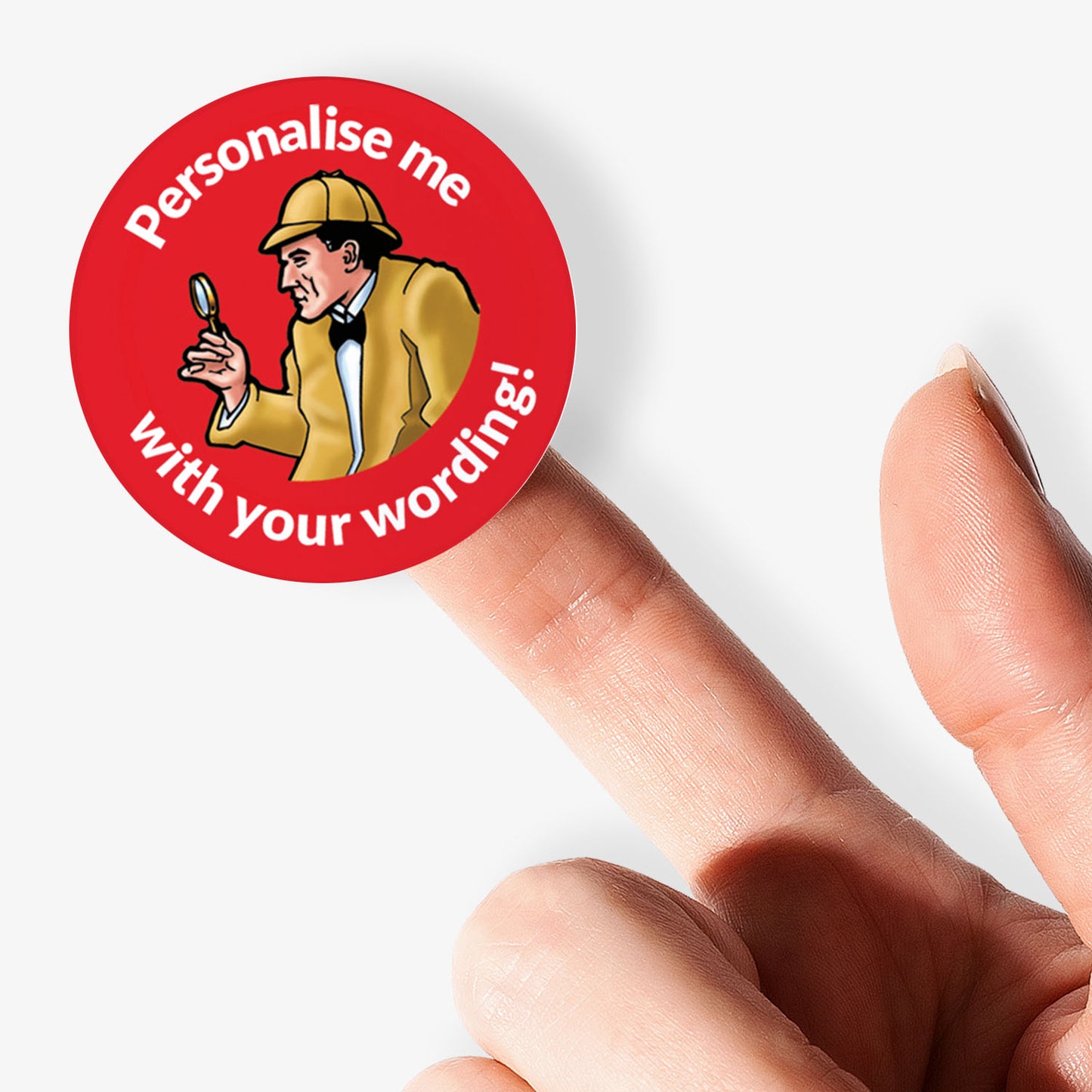 Red sticker, on a finger, with 'Sherlock Holmes' as the central image.  Space for personalisation above and below the image.