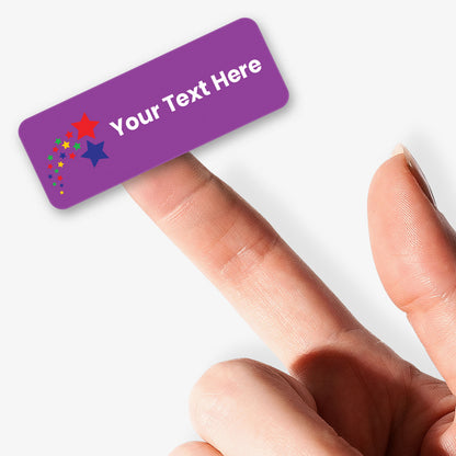 Purple stickers with white text and shooting stars icon icon held by a hand