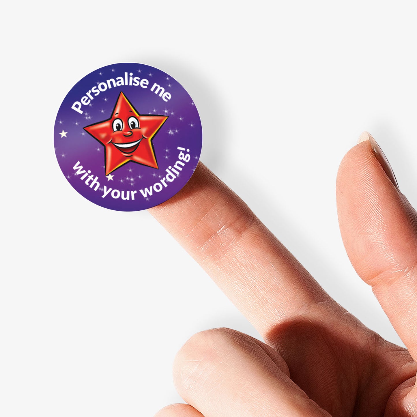 Round purple sticker with a red star and text 'Personalise me with your wording!' held between fingers.
