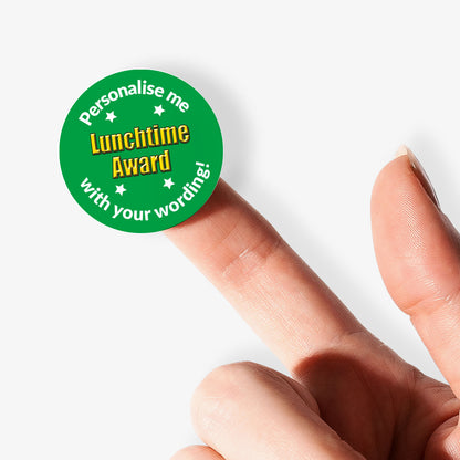 Circular stickers with a Lunchtime Award and text on a white background. Sticker held by a finger 